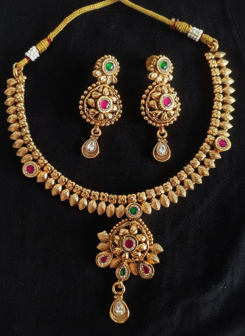 Antique Gold Leaf Motif Necklace Set with Floral Centre, Ruby & Emerald Stones & Chandbali Earrings for Women